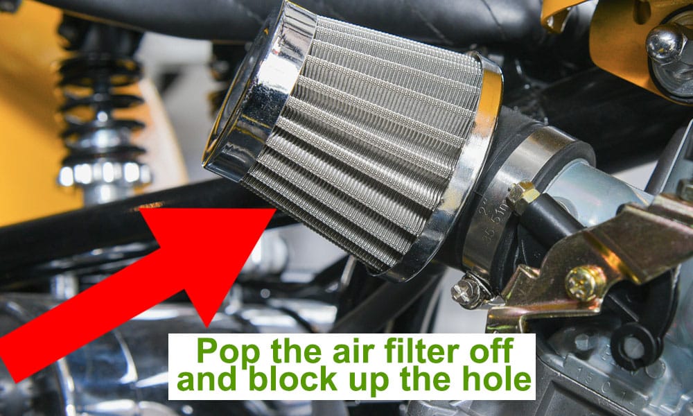 image of a motorcycle air filter and carburettor