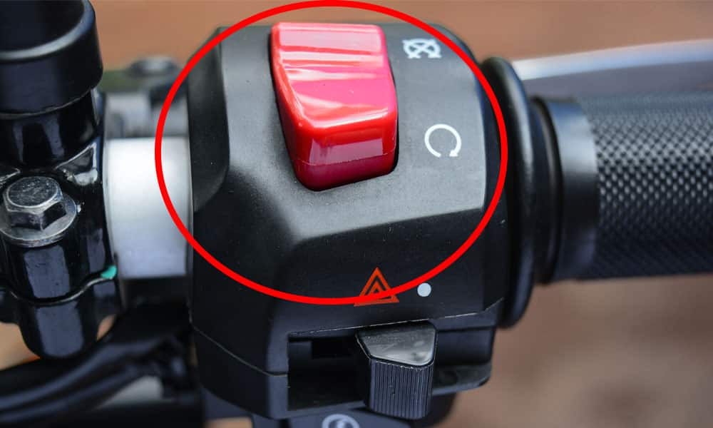 image of a motorcycle kill switch with a red circle around the switch to identify its location on the bikes handlebars 