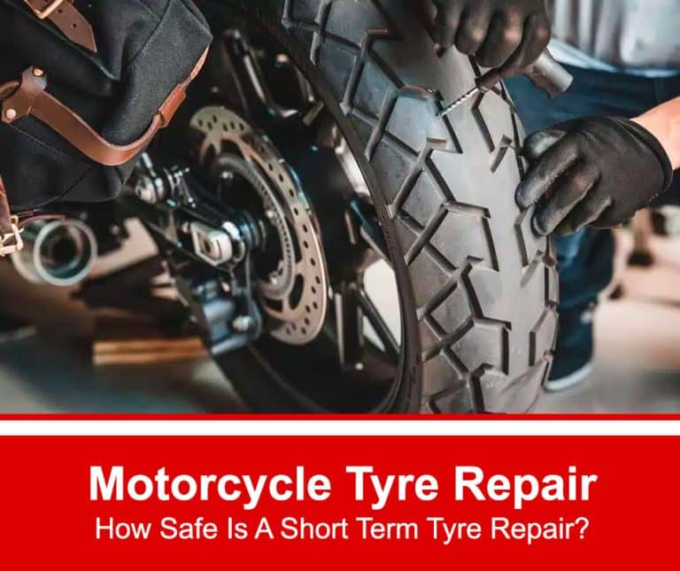 Motorcycle tyre being repaired by a man wearing rubber gloves