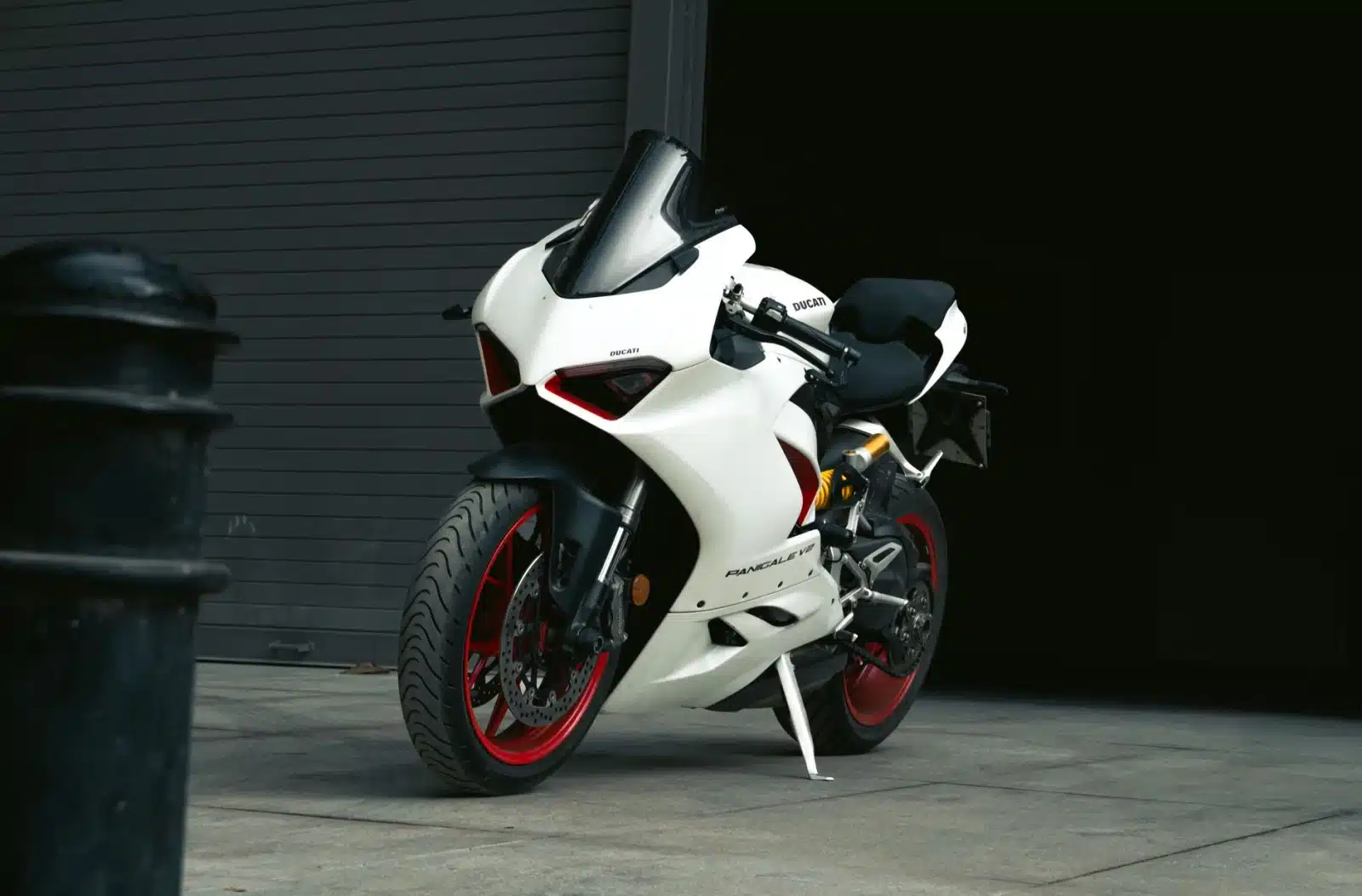 Close-up of a white Ducati motorbike parked outdoors in Bengaluru.