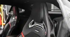 Close-up of a sleek, modern luxury car seat highlighting premium materials and design.