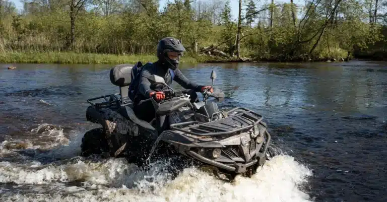 Exciting ATV ride through a river in Riga, Latvia, during summer.